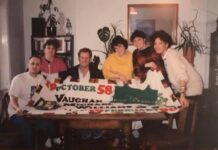 The friends of Vaughan Michael Williams, with the panel they made in his memory.