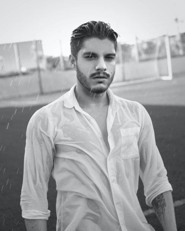 Photo by Cleyton Ewerton: https://www.pexels.com/photo/serious-wet-man-on-football-field-under-rain-5627760/