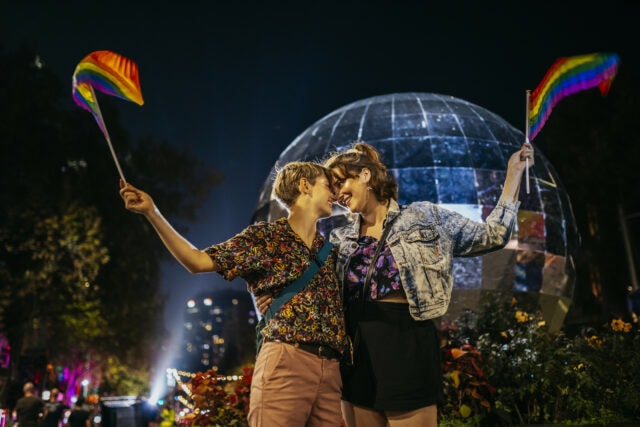 Couple embracing at Mardi Gras in Sydney Australia.