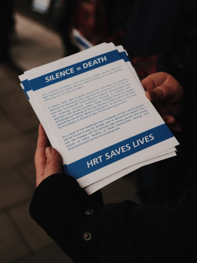 LGBTQ+ and feminist activists shut down NHS England Headquarters protesting rollback of trans healthcare.