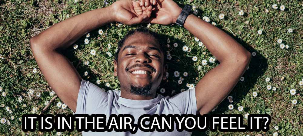 Man lying in the sunshine to illustrate why good weather has gay men feeling flirty in the summer sunshine.